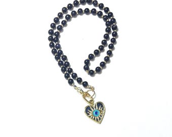 Donkerpaarse ketting met mystieke oogbedel "Dreamkeeper"