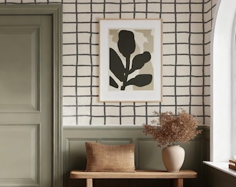 May include: Interior scene with a sage green door, a framed botanical print, and a wooden bench with a pillow. The walls are adorned with a grid pattern. A vase with dried flowers sits on the bench, and a window is visible.