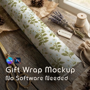 May include: Rolled gift wrap with a floral pattern of light blue flowers and green leaves on a cream background. The words "Gift Wrap Mockup No Software Needed" are visible. A pair of gold scissors and other craft supplies are in the background.