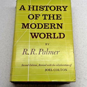Pode incluir: Um livro de capa dura intitulado A History of the Modern World por R.R. Palmer, Second Edition, Revised with the collaboration of Joel Colton. A capa é verde-limão brilhante com um padrão de grade branco e texto em preto.