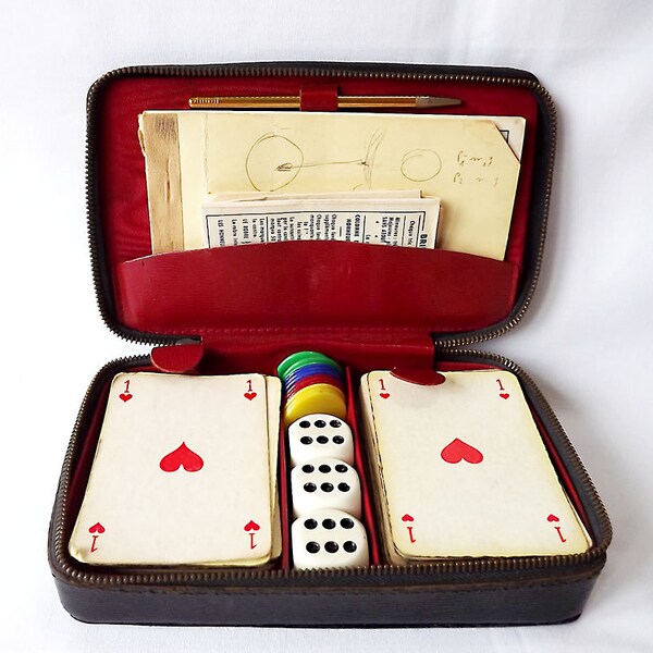 Two decks of cards in a case for bridge playing, with counters and three dice by Heron of France