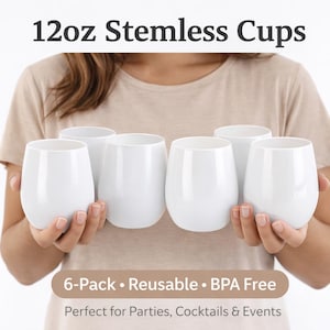 May include: Six white, stemless cups, each holding 12oz, are held in front of a person. The cups are smooth and rounded. Text at the top reads "12oz Stemless Cups." Below, text says "6-Pack • Reusable • BPA Free."