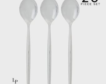 May include: A set of three silver spoons with long, slender handles. The image includes the text "20 PIECE SET" in black, and the "Luxe Party NYC" logo in black. The spoons are arranged against a light gray background.