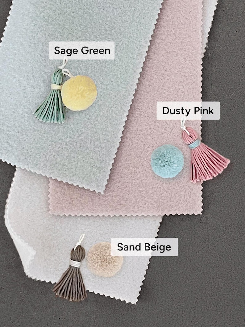 color options for baby milestone signs: sage green, dusty rose pink, sand beige with matching tassels and pompom. soft pastel color tones that are gender-neutral which make it perfect for gender reveal party, baby shower gift, and newborn arrival gift.
