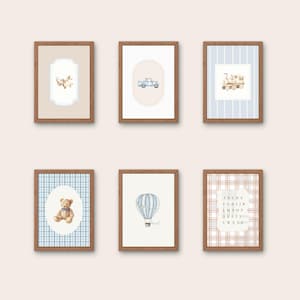 May include: Six framed art prints with a nursery theme. Each print features a watercolor illustration of a teddy bear, truck, train, hot air balloon, or alphabet letters. The frames are brown with a light background.