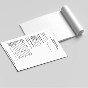 May include: A white notepad with a rolled top and a printed sheet with the text "ENERGY BUDGET" and sections for financial planning. The sheet includes sections for time frame, available money, and essential expenses.