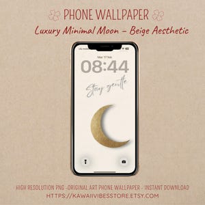 Puede incluir: Un teléfono inteligente muestra un fondo de pantalla estético beige. La pantalla de bloqueo muestra la hora, la fecha y las palabras "Stay gentle" sobre una luna creciente dorada. La parte superior de la imagen dice "PHONE WALLPAPER" y "Luxury Minimal Moon - Beige Aesthetic."