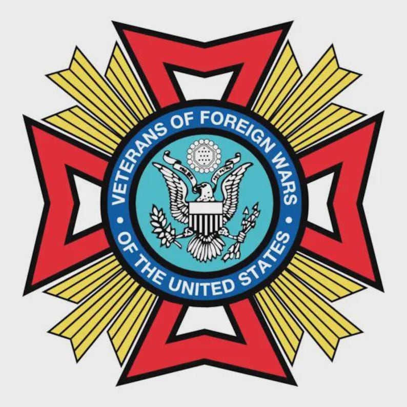 May include: A circular emblem with the text "VETERANS OF FOREIGN WARS OF THE UNITED STATES". The emblem features a red cross shape with gold and yellow accents. The center has a blue circle with an eagle and the US flag.