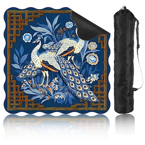 May include: A blue yoga mat with a peacock design, featuring intricate details and a bamboo-style border. The mat is accompanied by a black carrying bag with a shoulder strap. The peacock's feathers are blue, orange, and yellow.