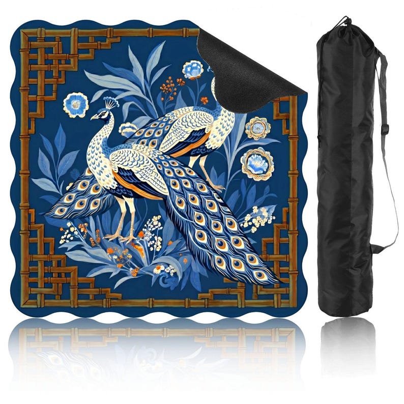 May include: A blue yoga mat with a peacock design, featuring intricate details and a bamboo-style border. The mat is accompanied by a black carrying bag with a shoulder strap. The peacock's feathers are blue, orange, and yellow.