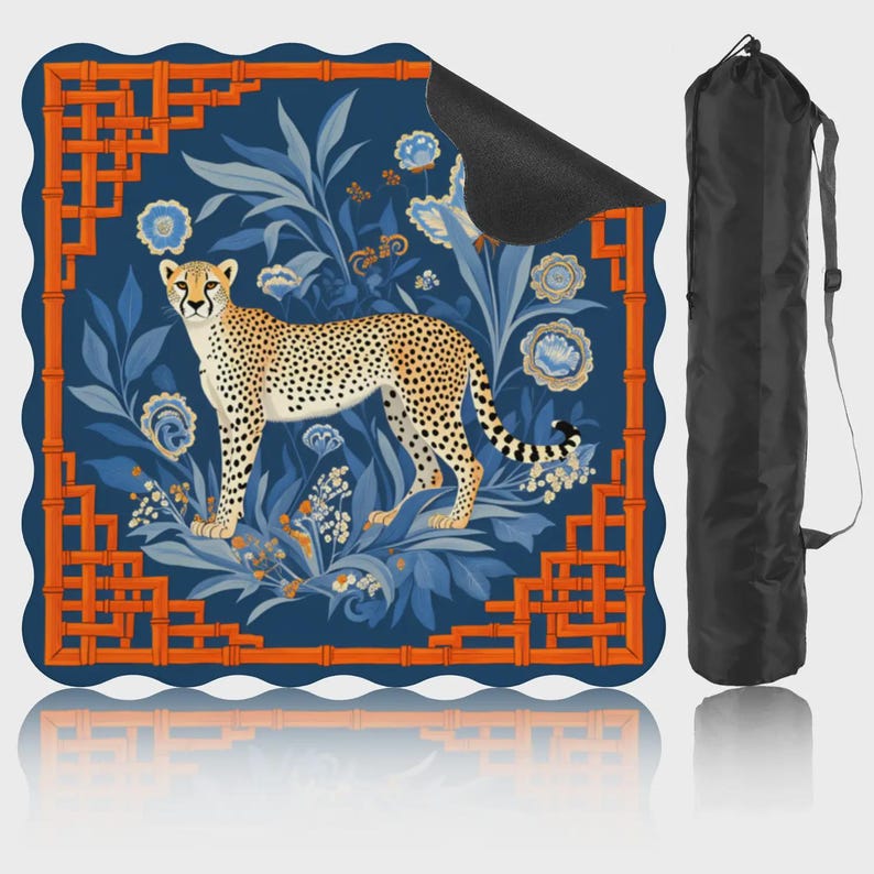 May include: A yoga mat featuring a cheetah design. The mat has a blue background with floral and bamboo-style orange accents. A black carrying bag is included. The cheetah is tan with black spots.