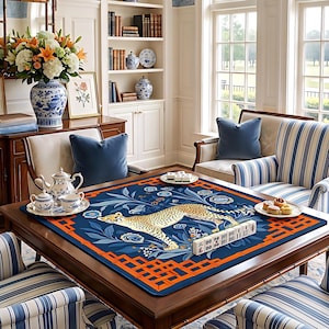 May include: A wooden game table with a blue and orange patterned mat featuring a cheetah design. The table is set with a mahjong set, tea set, and snacks. The room has a classic, elegant style.