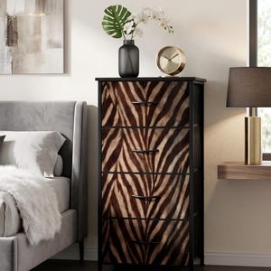 May include: A tall, narrow chest of drawers featuring a black metal frame and four drawers with a brown and black zebra-striped pattern. Each drawer is equipped with a thin, horizontal black handle. The unit stands on four simple legs.