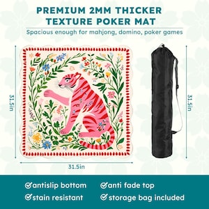 May include: A poker mat with a pink tiger design, surrounded by floral elements. The mat is 31.5 inches square and includes a black storage bag. The text on the mat reads "PREMIUM 2MM THICKER TEXTURE POKER MAT".