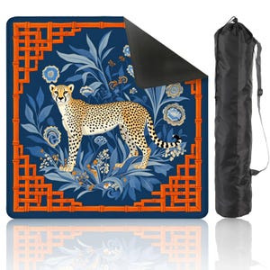 May include: A blue yoga mat featuring a cheetah design surrounded by blue floral patterns and orange bamboo-style borders. Includes a black carrying bag with a shoulder strap. The mat is designed for exercise and fitness.