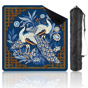 May include: A blue yoga mat featuring a peacock design with intricate details. The mat showcases two peacocks with blue and white feathers, surrounded by floral and bamboo-style border elements. Includes a black carrying bag.