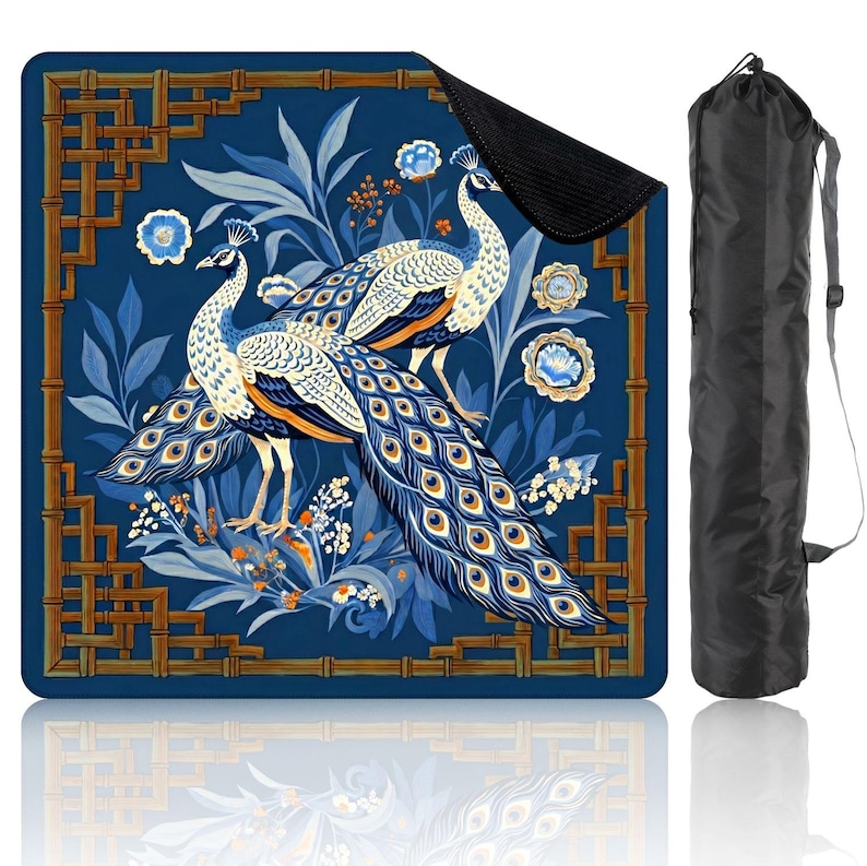 May include: A blue yoga mat featuring a peacock design with intricate details. The mat showcases two peacocks with blue and white feathers, surrounded by floral and bamboo-style border elements. Includes a black carrying bag.