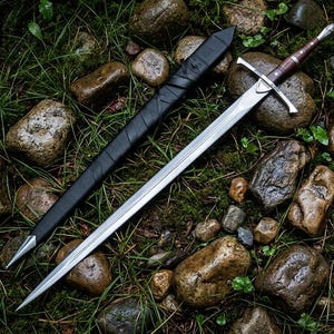 May include: A steel sword with a double-edged blade, a silver crossguard, and a dark brown wooden handle with a silver pommel. Beside the sword lies a black leather scabbard featuring a silver metal tip and a wrapped cord design along the length.