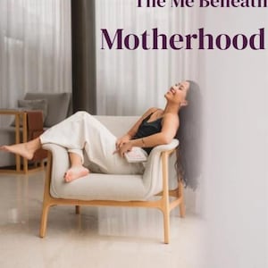 May include: A woman relaxes on a light-colored armchair, wearing a black top and white pants, with a book in hand. The image features text that reads "The Me Beneath Motherhood" and "A guide back to yourself."