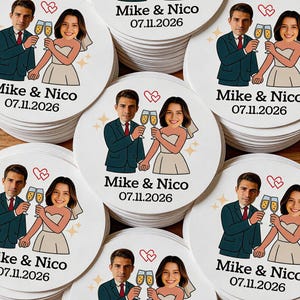 May include: A stack of white, round coasters featuring a cartoon illustration of a couple toasting champagne glasses. The text "Mike & Nico 07.11.2026" is printed on each coaster, along with a heart symbol and starbursts.