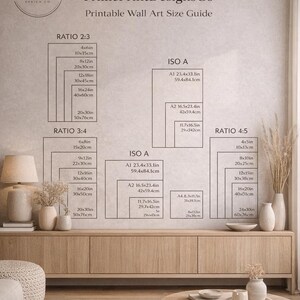 May include: Printable wall art size guide from PrimePrintDesignsCo. Includes size charts for Ratio 2:3, 3:4, 4:5, and ISO A formats, with measurements in inches and centimeters. The guide is displayed on a neutral-toned wall.