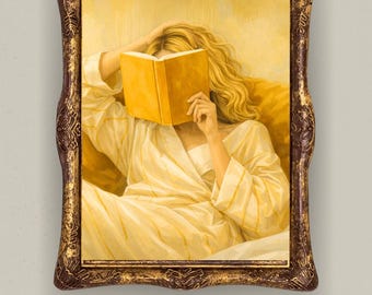 May include: A framed painting depicts a person with long blonde hair, wearing a yellow robe, reading a book. The person's face is obscured by the book. The frame is ornate with a dark brown and gold finish.
