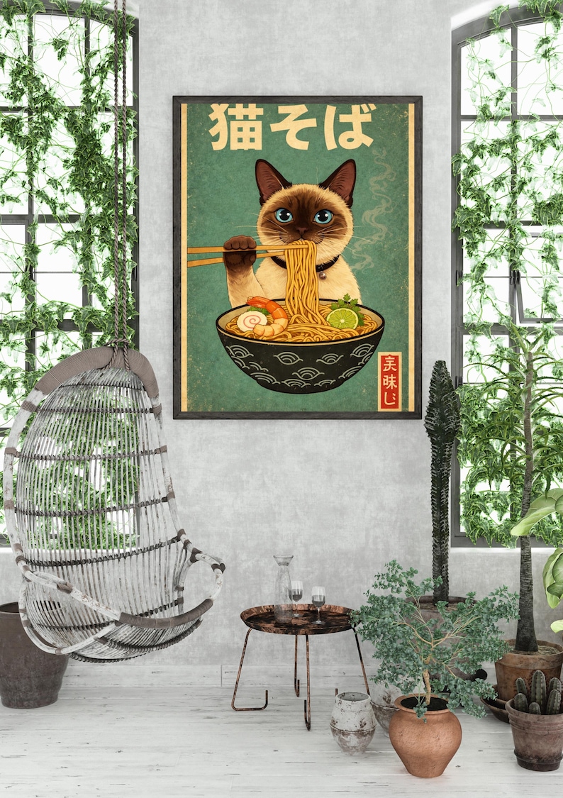 May include: A framed poster featuring a Siamese cat enjoying ramen noodles. The cat, with blue eyes, holds chopsticks with noodles. The bowl has shrimp and lime. Japanese text is at the top and bottom. The poster is on a green background.