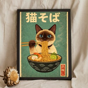 May include: A framed print featuring a Siamese cat enjoying ramen noodles with chopsticks. The cat is depicted with blue eyes and a black collar. The bowl of ramen includes shrimp and lime. The Japanese text "猫そば" is at the top.