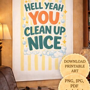 May include: A framed print with the words "HELL YEAH YOU CLEAN UP NICE" in teal, orange, and white. The background has yellow stripes. Additional text reads "DOWNLOAD PRINTABLE ART" and "PNG, JPG, PDF Included Print today!"
