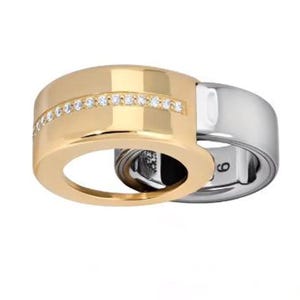 May include: A two-tone ring featuring a wide gold band with a horizontal row of small clear stones and a smooth silver band interlocking with it. The interior of the silver band is clearly marked with the number 9, indicating the ring size.