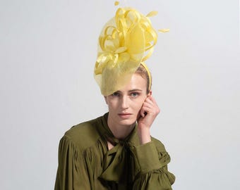 Yellow Flower Fascinator on a Cream Headband With Hand  display picture 1