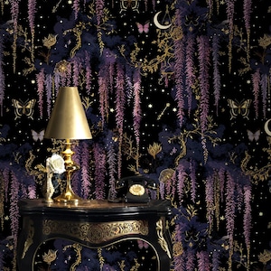 May include: Black wallpaper with a repeating pattern of purple wisteria, butterflies, and stars. A gold-toned lamp and a black table with gold accents are in the foreground. A vintage black telephone sits on the table.