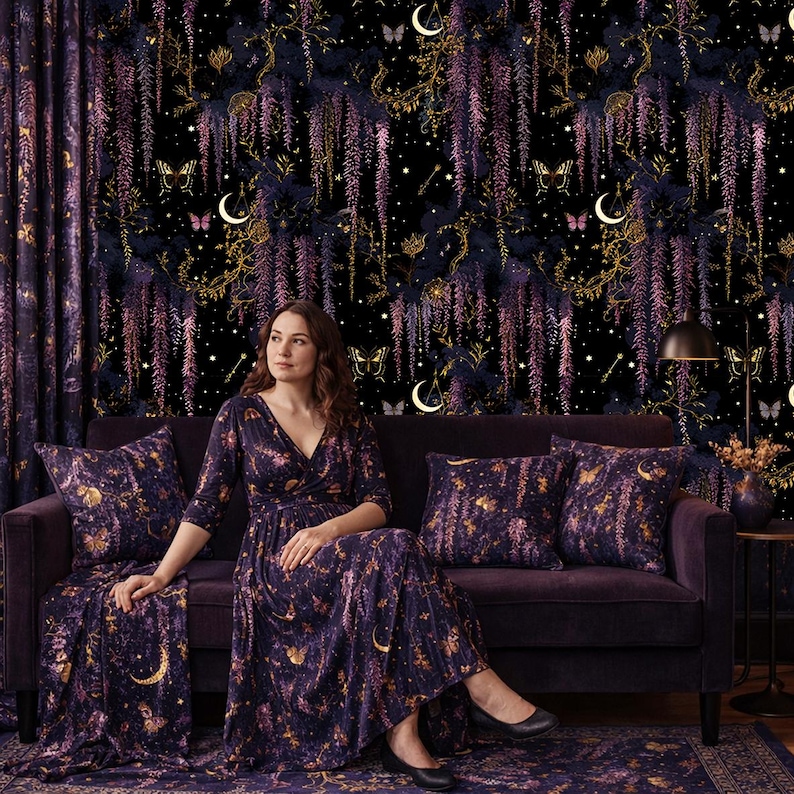 May include: A woman sits on a purple velvet sofa with matching pillows and a rug. The background is a dark floral wallpaper with gold accents, butterflies, and crescent moons. The woman wears a long-sleeved dress with a similar pattern.