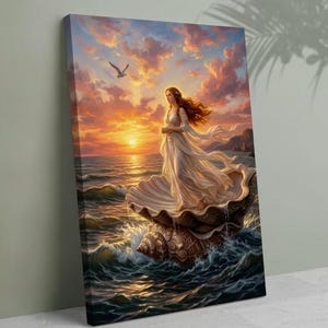 Puede incluir: Impresión en lienzo que representa a una mujer con un vestido blanco ondeante de pie en una concha marina sobre el océano. La obra de arte presenta una vibrante puesta de sol con tonos de naranja, rosa y amarillo. Una gaviota vuela en el cielo sobre las olas del océano.