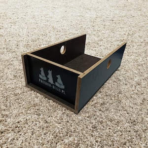 May include: A wooden box with a dark blue exterior and a dark interior. The box has a rectangular shape with two circular holes and the text "PASSION-DOGS PL" with dog silhouettes.