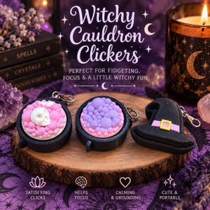 May include: Three black plastic fidget toys including two round cauldrons filled with pink and purple textured bubbles, one featuring a white skull, and a black witch hat with a pink band and yellow buckle, all attached to silver metal keychains.