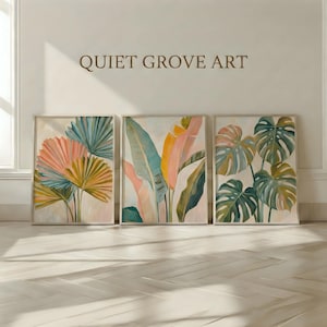May include: Three framed botanical art prints featuring colorful plant illustrations. The prints showcase fan-shaped and broad-leafed plants in shades of pink, blue, yellow, and green. The text "QUIET GROVE ART" is displayed above the prints.