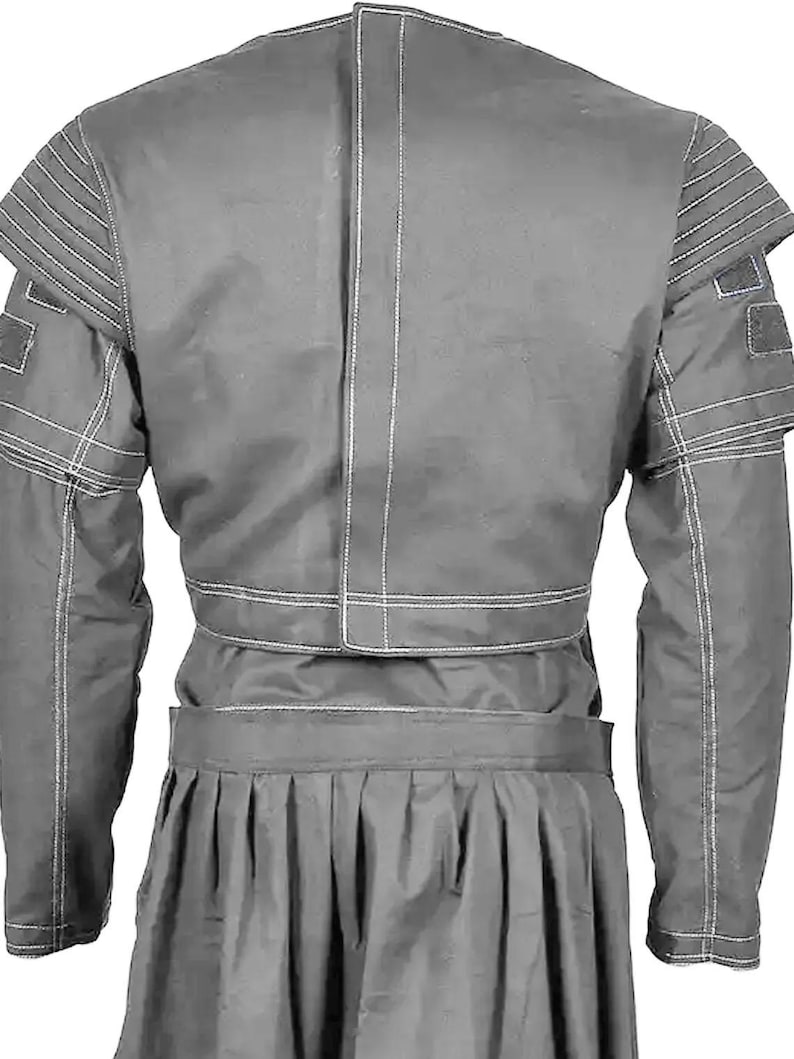 May include: A gray jacket and skirt set. The jacket features structured shoulders with horizontal stitching and square patches on the sleeves. The skirt is pleated. White stitching accents the seams of the jacket.