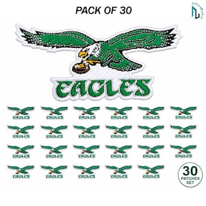 May include: A pack of 30 embroidered patches featuring a green and white eagle logo with the text EAGLES. The design depicts an eagle in flight clutching a football. The set includes one large patch and 29 smaller identical patches.
