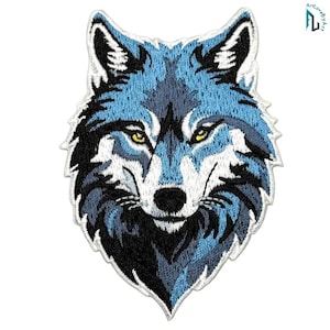May include: An embroidered patch featuring the head of a wolf in shades of blue, white, black, and grey. The wolf has piercing yellow eyes and a detailed fur pattern. The patch has a white border and the text ArtLoveByArt in the top corner.