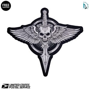 May include: A black and white embroidered patch featuring a skull with wings, a sword, and a circular design. The patch has the words "FREE SHIPPING" in a black circle in the upper left corner. The United States Postal Service logo is at the bottom.