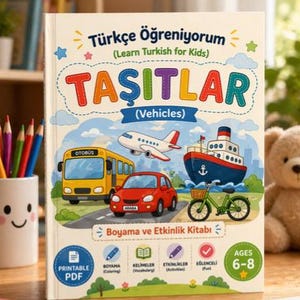 May include: A children's book titled "Learn Turkish for Kids" with the word "TAŞITLAR" (Vehicles) in large, colorful letters. Illustrations include a yellow bus, red car, airplane, ship, and bicycle. The book is for ages 6-8.