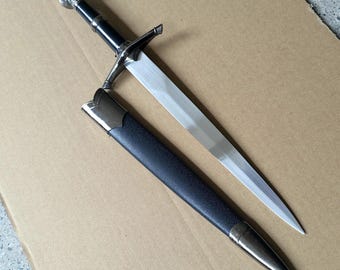 Handcrafted lion-head handle medieval short sword, with black scabbard.Artistic decorative items.