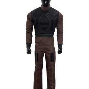 May include: A brown tactical outfit displayed on a mannequin. The outfit includes a long-sleeved shirt, pants, and a black vest. White stitching accents the seams. The mannequin has a black head and is standing on a black base.