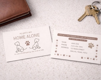 May include: Two white rectangular emergency contact cards with brown text and graphics. One card reads my pets are HOME ALONE with two dog line drawings and paw prints. The other card lists contact details for Jane Doe with paw print borders.