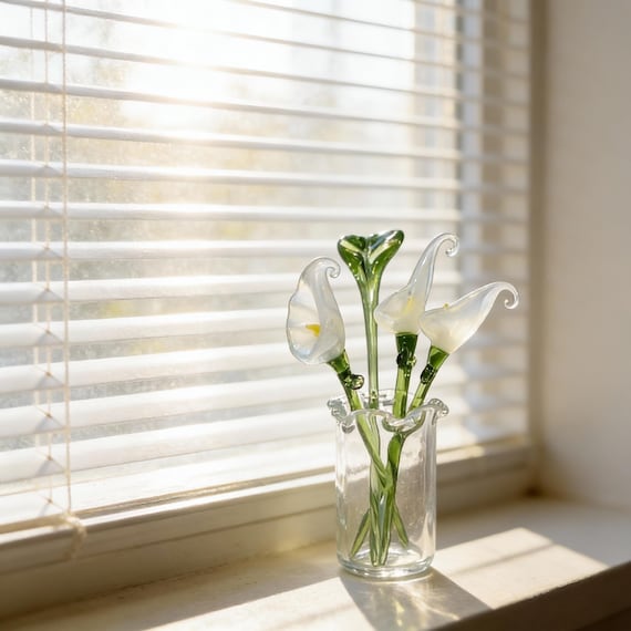 A $10 hand-blown glass calla lily in a tiny vase — 421 hearts don't lie, this is the kind of delicate artisan piece that looks like it costs ten times more.