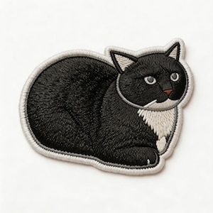 May include: Embroidered patch featuring a black and white cat in a relaxed pose. The cat has a black body, white chest, and a white outline. The cat's eyes are white, and the nose is brown. The patch is designed to be ironed on or sewn onto fabric.
