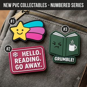 May include: Three PVC patches labeled #1, #2, and #3. Patch #1 is a yellow star with a blue and pink trail. Patch #2 is a rectangular magenta sign with a snowflake icon and the text HELLO. READING. GO AWAY. Patch #3 is a dark green book with a grumpy face and a white coffee mug icon with the text GRUMBLE!.