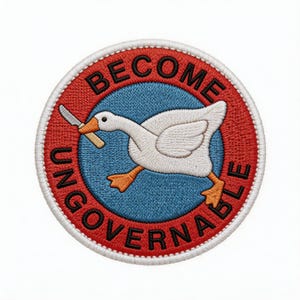 May include: Embroidered patch with a white goose holding a knife in its beak, set against a blue background. The patch is encircled by a red ring with the words "BECOME UNGOVERNABLE" in black lettering. The goose has orange feet and beak.