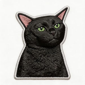 May include: Embroidered patch featuring a black cat with green eyes and pink inner ears. The cat is outlined with a white border. The patch has a textured appearance, suggesting a high-quality, detailed design. Ideal for jackets, bags, or other fabric items.